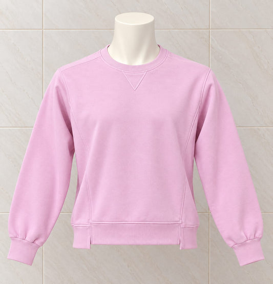 Light pink crew neck sweatshirt with long sleeves, ribbed cuffs and hem, displayed on a mannequin