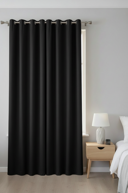 Navy blackout curtain in a modern bedroom